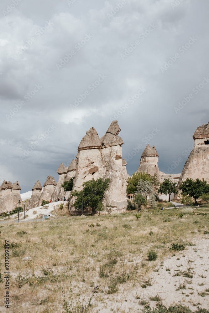 cliffs of cappadocia in sunny weather against the background of a cloudy sky