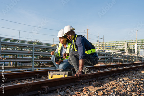 Engineer wearing safety uniform sitting on railway inspection. construction worker on railways. Engineer work on Railway. Rail, engineer, Infrastructure.