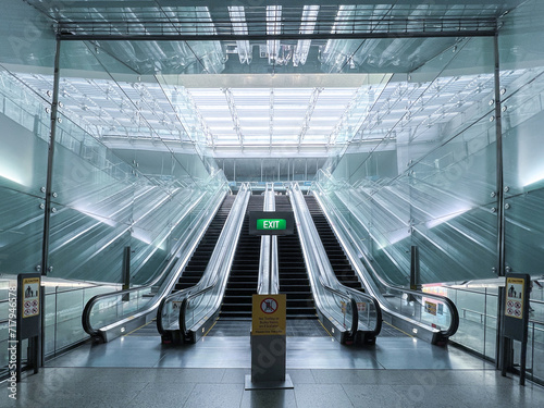 Airport Interior with Glass Escalator in an Empty Hallway