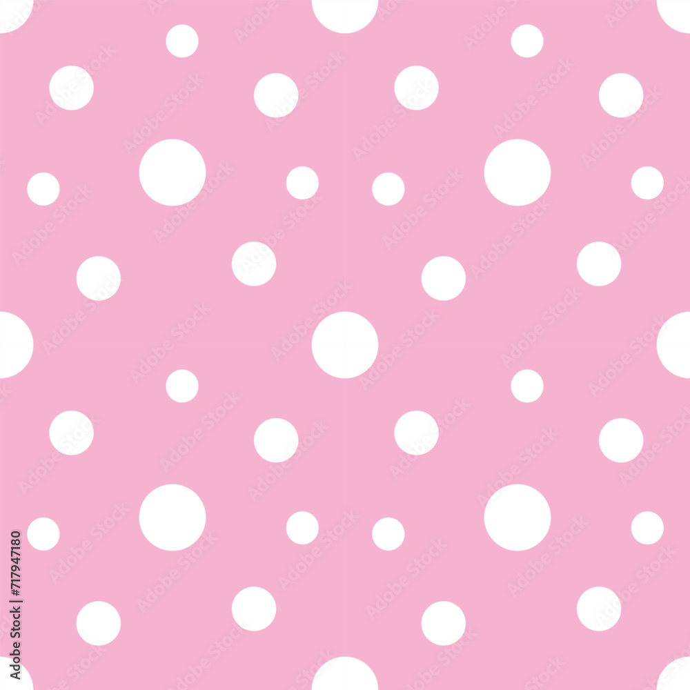 seamless polka dots pattern on pink background 