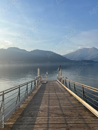 Pier at Lake Como Blue water landscape, Lierna in Northern Italy - Calm and relax scene serene with clear sky 