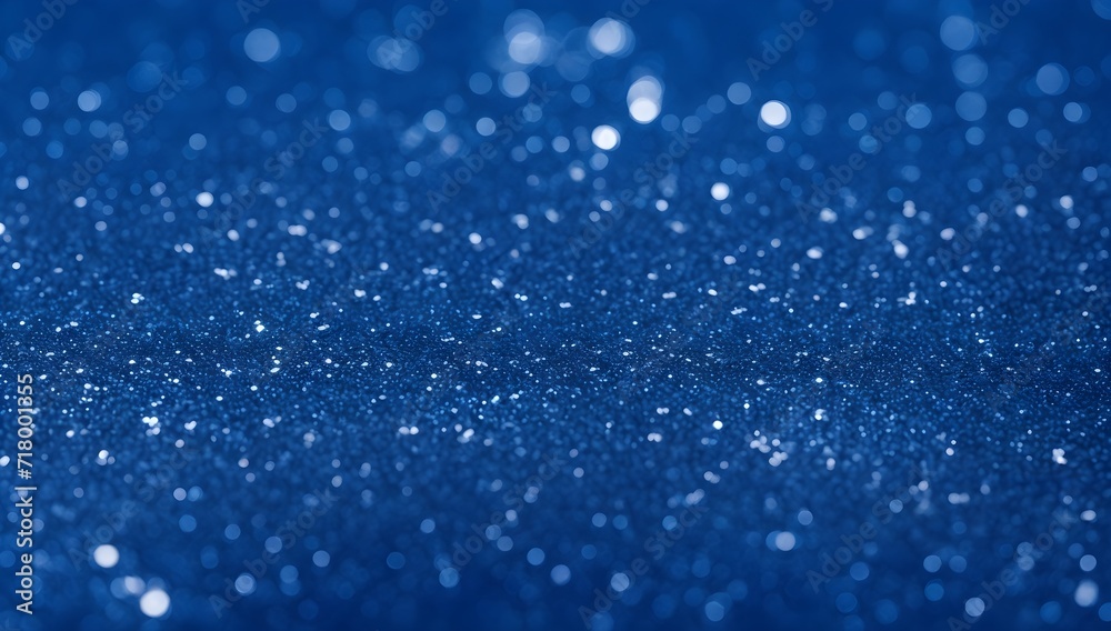 Blue glitter background. Abstract blue backdrop with shiny particles.