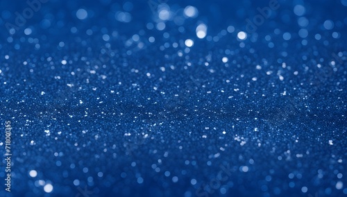 Blue glitter background. Abstract blue backdrop with shiny particles.