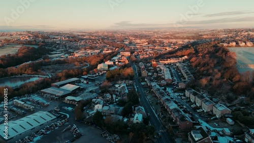Daybreak on a very cold winters morning in Yorkshire, UK. Middle-class suburban houses in English market town village. Winter, snow, cold, freezing weather.