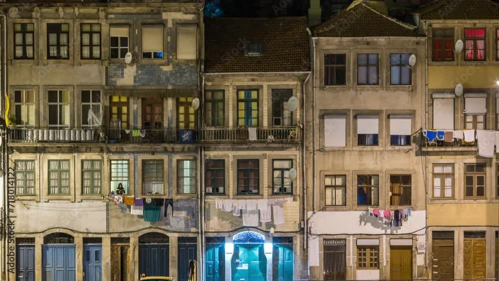 Waterfront and traditional quaint houses in the old, vintage and touristic ribeira district of Porto at night timelapse, Portugal Waterfront and traditional quaint houses in the old, vintage and touristic ribeira district of Porto at night timelapse, Portugal