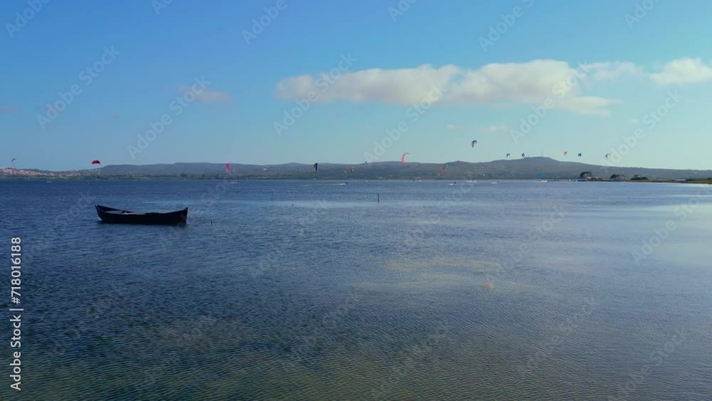 Scenic drone shot of Kite surfing at Punta Trettu beach, San Giovanni Suergiu, South Sardinia, Italy Scenic drone shot of Kite surfing at Punta Trettu beach, San Giovanni Suergiu, South Sardinia, Italy