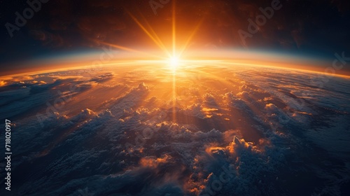 Red bright sunset with the rays of the sun at a bird's eye view, from space and clouds, beautiful landscape wallpaper for desktop