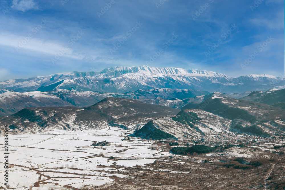 Campo Felice, Italy - The suggestive plateau peak in Abruzzo region, Monte Rotondo summit mount range, during the winter with snow and alpinists in altitude