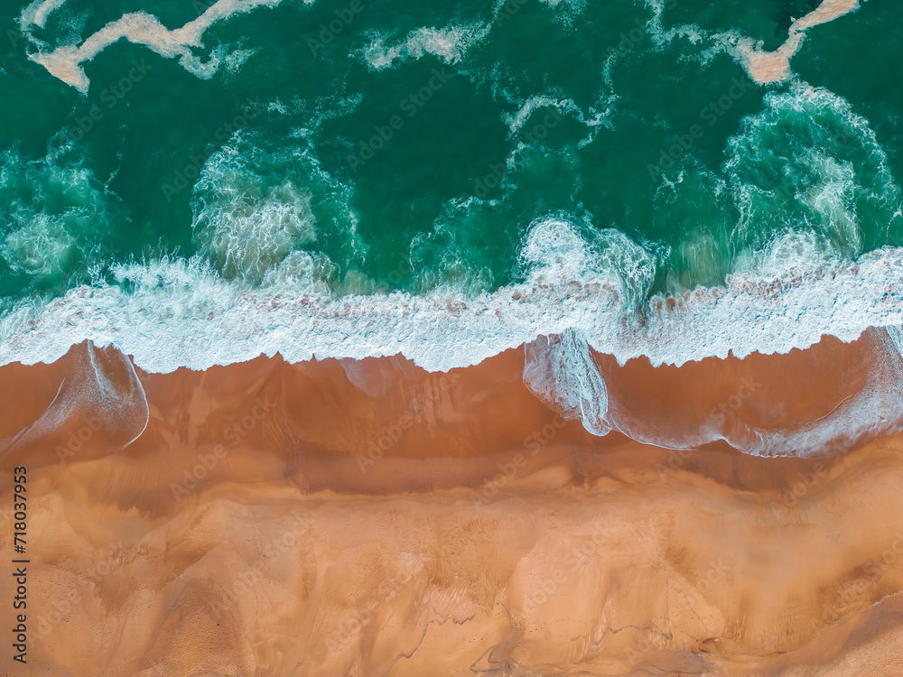 Ocean Dance: A Captivating Aerial Perspective of São Martinho do Porto's Azure Waves and Golden Sands
