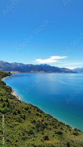 a lake on the shoreline of a mountainous area near mountains