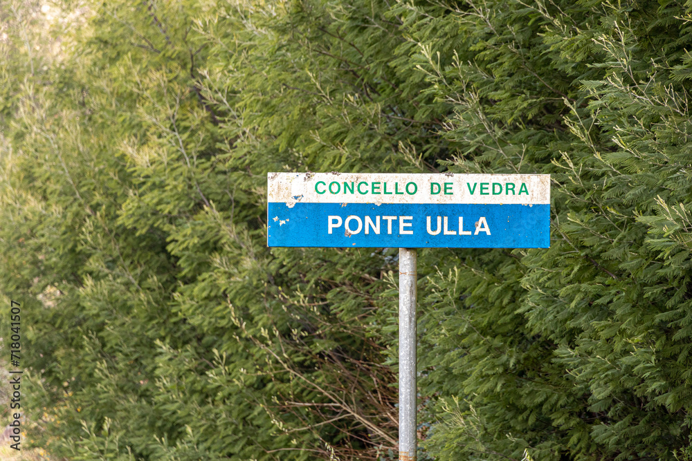 A Ponte Ulla, Spain. Road sign indicating directions to Concello de Vedra and Ponte Ulla