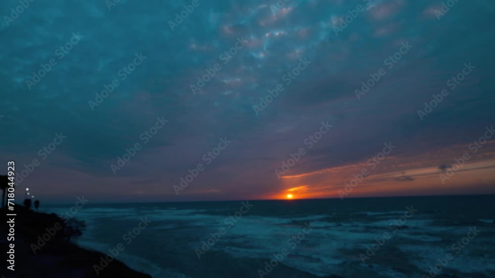 Beautiful sunset at the beach Time lapse. Hawaiian ocean tide, a tropical landscape, golden hour, orange horizon sky leaks. cinematic surfing clouds. 4K static video Beautiful sunset at the beach Time lapse. Hawaiian ocean tide, a tropical landscape, golden hour, orange horizon sky leaks. cinematic surfing clouds. 4K static video