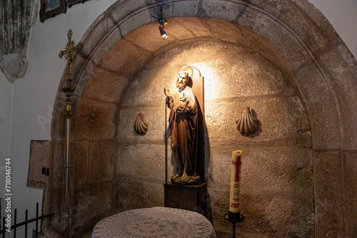 A Ponte Ulla, Spain. Statue of Saint John the Baptist inside the Parish Church of Santa Maria Magdalena, a Galician Baroque Catholic temple photo