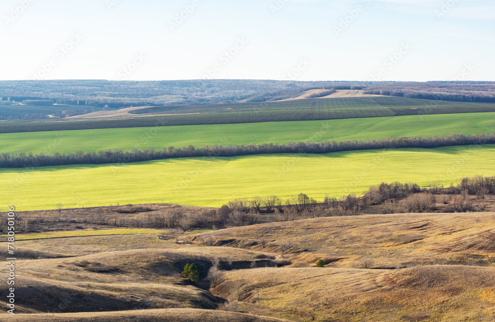 Beautiful landscape with rural field, hills, ravines in early spring or autumn. Samara region, Bald mountain