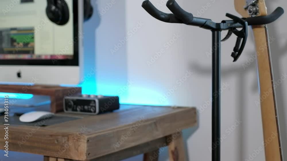 a medium shot of a man playing guitar solos, chords and rhythm with bass in a studio focussing on the hands a medium shot of a man playing guitar solos, chords and rhythm with bass in a studio focussing on the hands