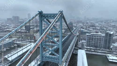 Aerial shot of the Benjamin Franklin Bridge on a snowy day. Downtown urban Philadelphia in winter. photo