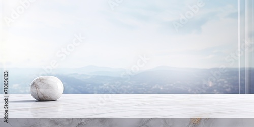 Choosing to blur the window glass backdrop, a marble table top is featured for presenting products. photo