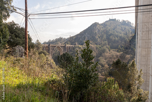 A Ponte Ulla, Spain. The viaduct of Gundian, a stone and iron rail bridge over the river Ulla photo