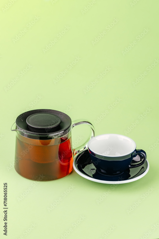 tea set from a teapot and mug on a colored background tea set from a teapot and mug on a colored background