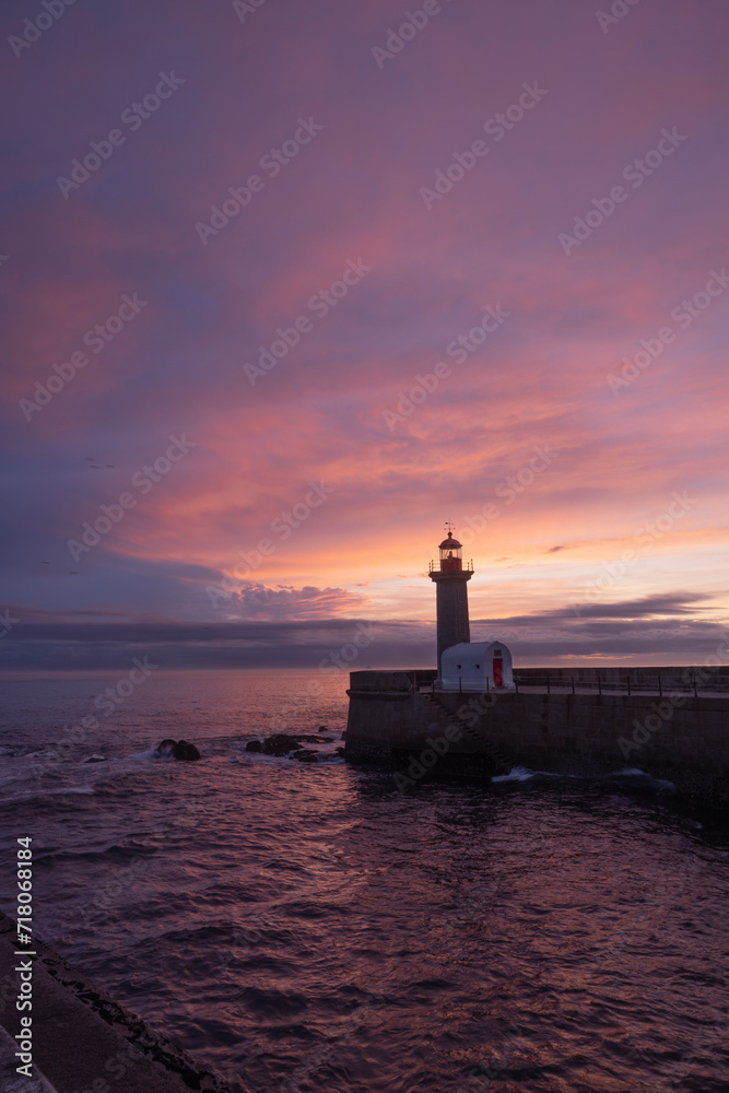 lighthouse at sunset in Porto