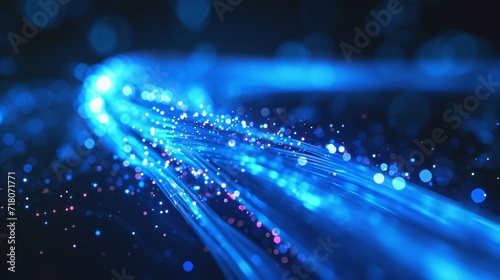 A representation of a high-speed internet cable, silk waves in cobalt blue and optic fiber-like strands of light.