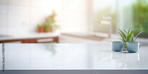 White glossy counter top with a blurred kitchen room background.