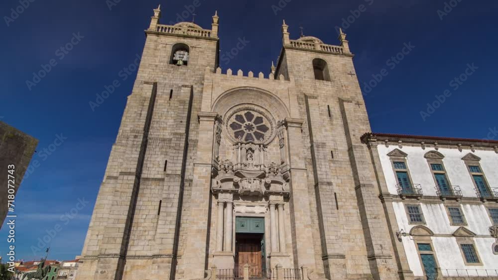 Porto Cathedral or Se Catedral do Porto timelapse hyperlapse front view with blue sky at sunny day. Romanesque and Gothic architecture. Porto Cathedral or Se Catedral do Porto timelapse hyperlapse front view with blue sky at sunny day. Romanesque and Gothic architecture.