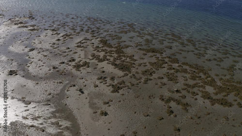 Aerial Seascape with Clear Water and Distant Mountains.
Birds eye view of a sandy beach across from Torghatten in Norway. Aerial Seascape with Clear Water and Distant Mountains.
Birds eye view of a sandy beach across from Torghatten in Norway.