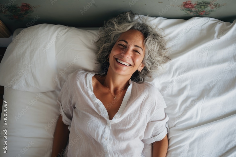 Portrait of a smiling senior hispanic woman in bed Portrait of a smiling senior hispanic woman in bed