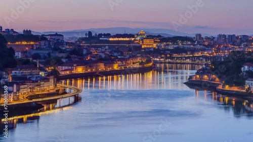 Aerial view before sunrise at the most emblematic area of Douro river timelapse night to day transition. World famous Porto wine production area.