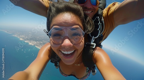 a moment of exhilarating joy, showing two people skydiving.   photo