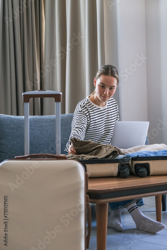 Travel.Suitcase, Staycation.Girl packing luggage in suitcase and travel documents Travel,tourism,vacation,relocation.Mental health and travel vacation