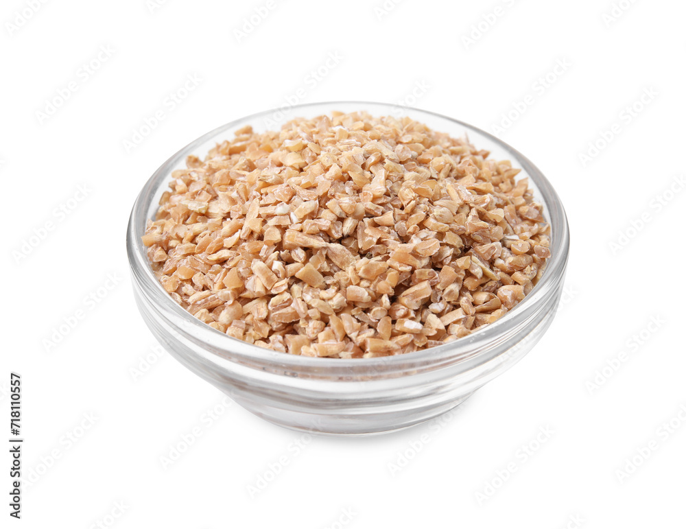 Dry wheat groats in glass bowl isolated on white