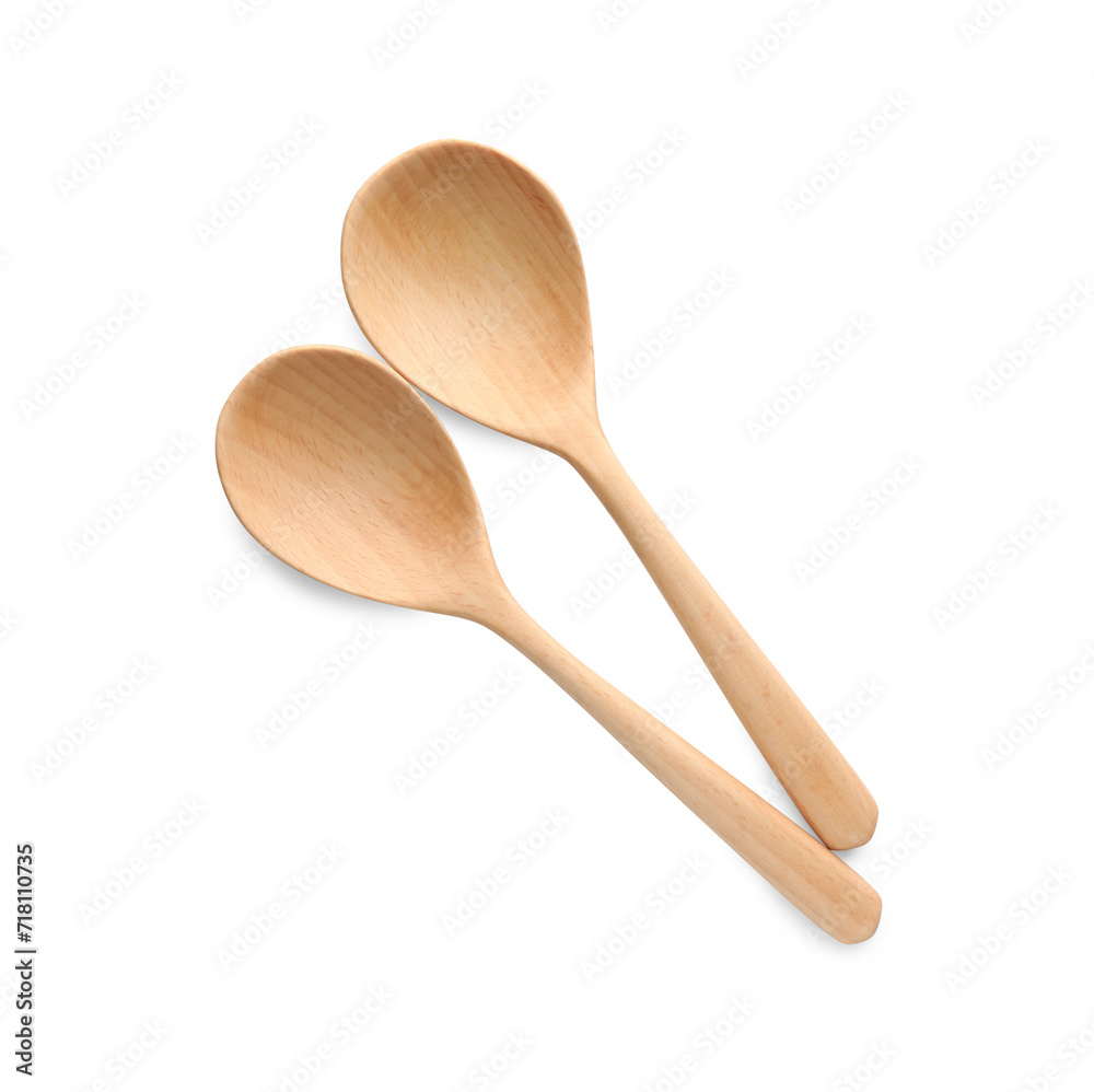 Two wooden spoons isolated on white, top view Two wooden spoons isolated on white, top view