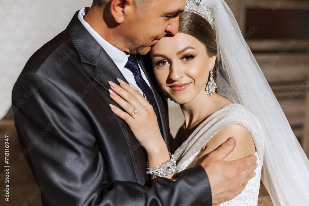 A beautiful bride with her father on her wedding day. The best moments of the wedding day. Daughter and father. A beautiful bride with her father on her wedding day. The best moments of the wedding day. Daughter and father.