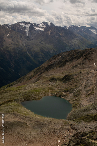 beautiful hearth shaped lake in the mountains in summer