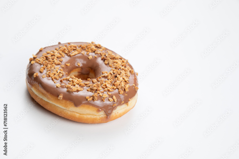 Chocolate peanut doughnut isolated on a white background Chocolate peanut doughnut isolated on a white background