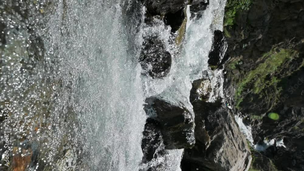 mountain river stream with clear water with stones in summer. Vertical slow motion mountain river stream with clear water with stones in summer. Vertical slow motion