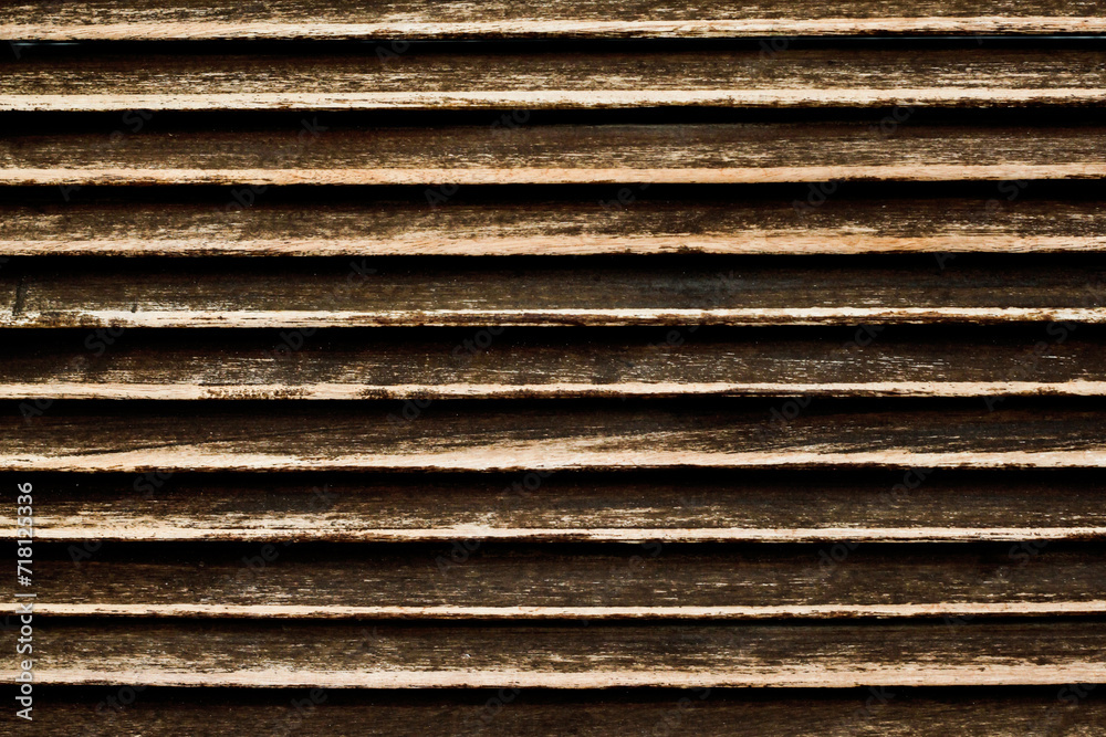 Grunge wood stripes. Raw brown wooden wall background. Rustic tree desk with knots pattern. Countryside architecture wall. Village building construction. Brown wood texture. Wooden lines pattern.