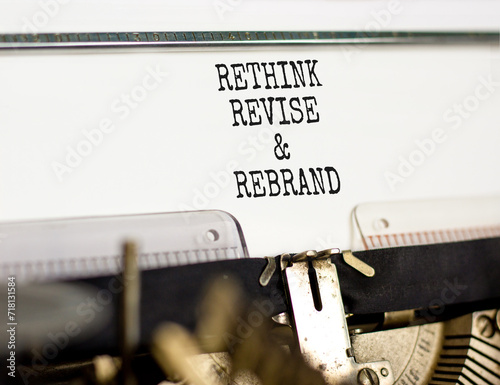 Rethink revise rebrand symbol. Concept word Rethink Revise and Rebrand typed on typewriter. Beautiful white paper background. Business brand motivational rethink revise rebrand concept. Copy space photo