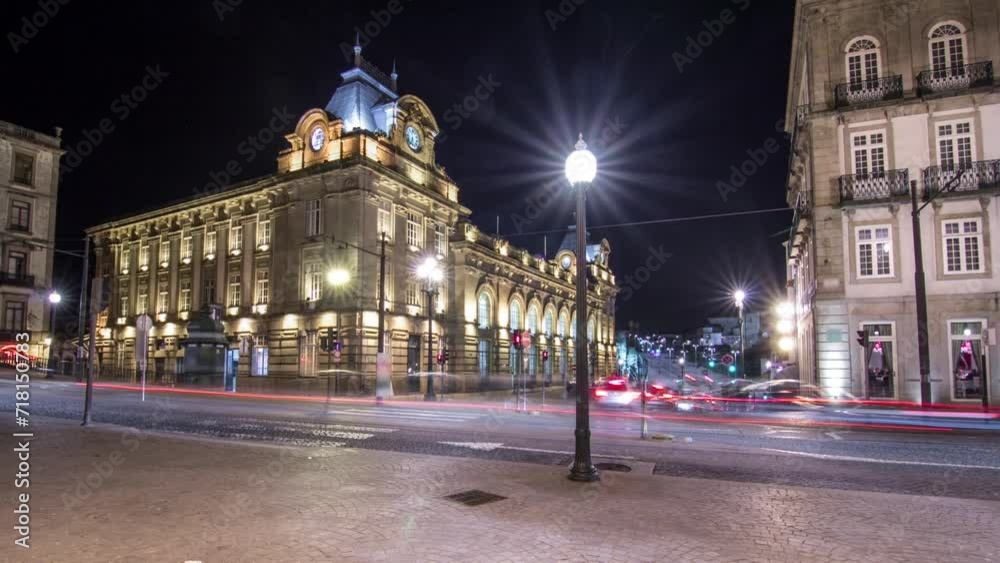The crossroads with the illuminated Sao Bento Railway Station night timelapse hyperlapse. The building of station is a popular tourist attraction of Europe. The crossroads with the illuminated Sao Bento Railway Station night timelapse hyperlapse. The building of station is a popular tourist attraction of Europe.