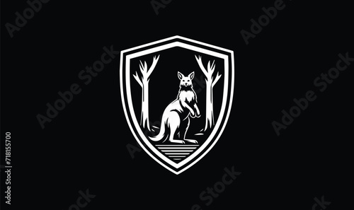 shield with wings  wolf is standing  grass on black background