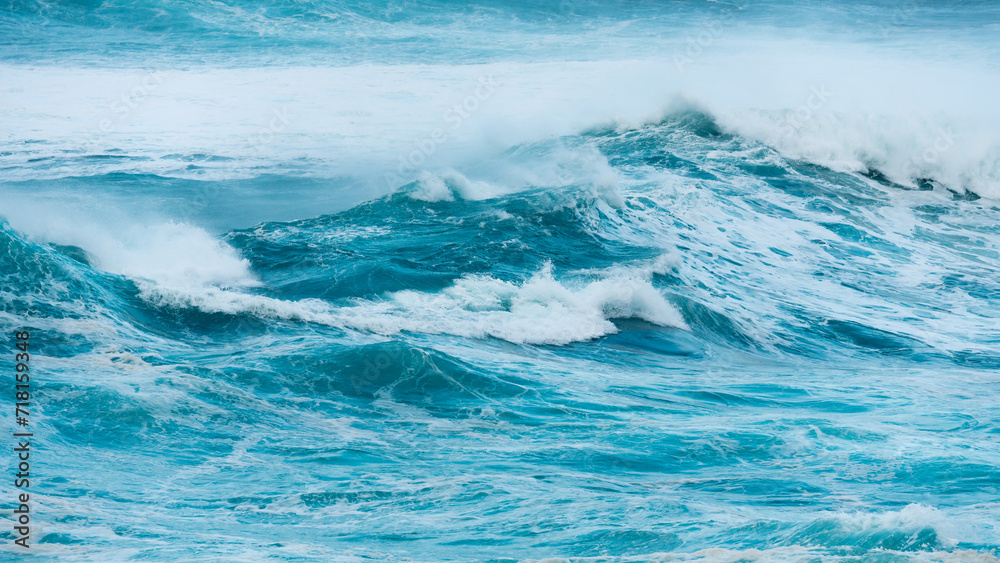 Blue ocean waves abstract background. Rough sea water during stormy weather