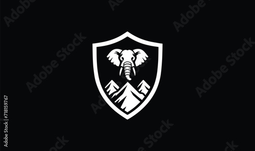 shield with wings and elephant face  mountain  on blackground