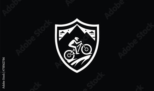 shield with swords and cycling and mountain