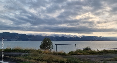 lake sevan in armenia and clouds falling over the mountains