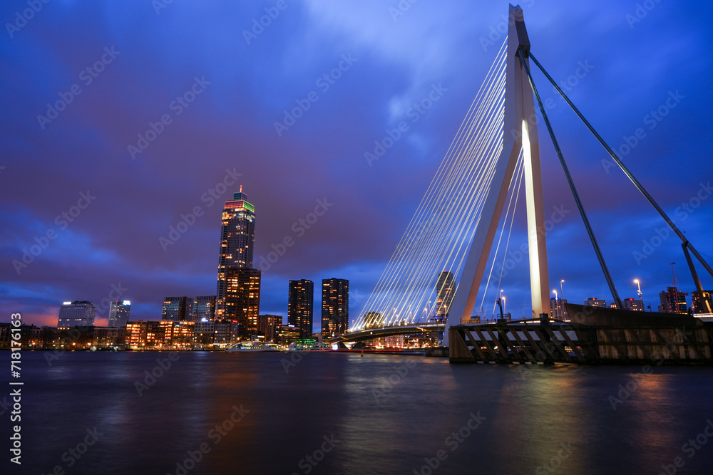 Rotterdam, Netherlands - December 26, 2023: Rotterdam Skyline with Erasmus bridge at twilight.