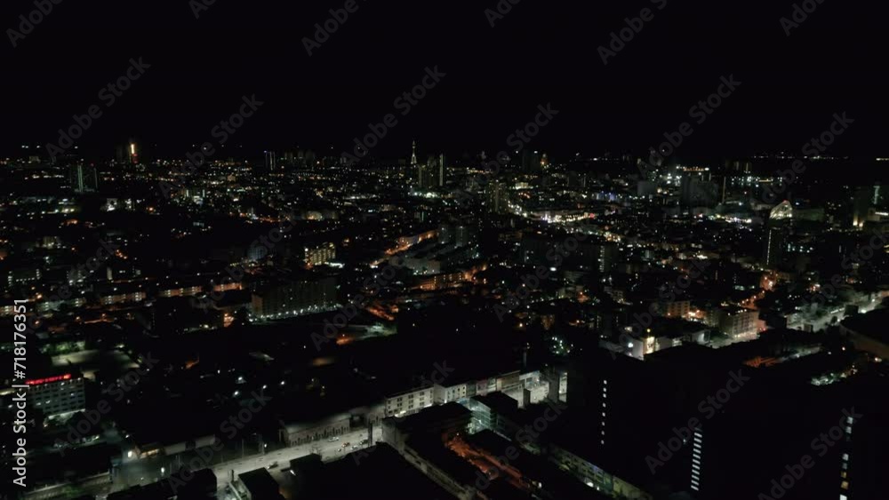 Night illuminated flight over a big city traffic aerial top down panorama 4k. Night evening roads of the city full of traffic Night illuminated flight over a big city traffic aerial top down panorama 4k. Night evening roads of the city full of traffic
