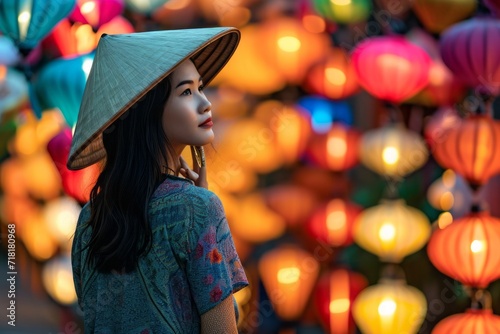 Asian woman wearing conical Non La hat against colorful Chinese aerial lanterns background