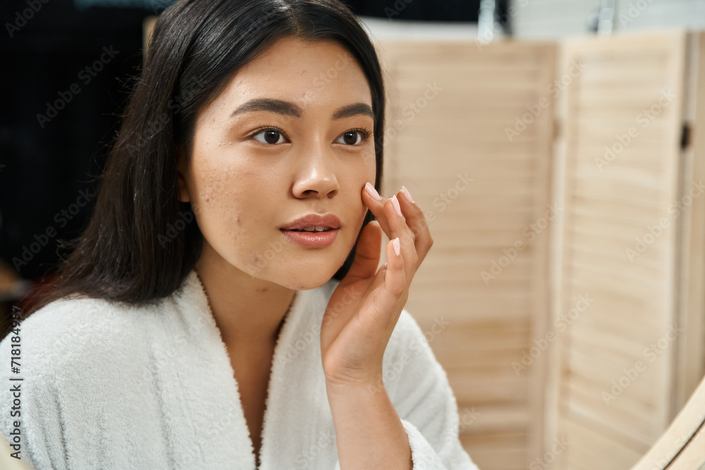 Ταπετσαρία young asian woman with brunette hair and acne prone skin looking at mirror in ba